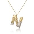 Detail of two-tone letter N pendant with hammered texture and golden box chain - Letter N