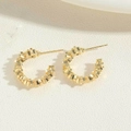 Detailed view of gold C-shaped hoop earrings featuring a faceted mosaic texture design - C-Shape Stacked Texture / 14K Gold