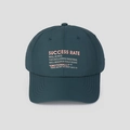 Detail of waterproof nylon fabric and pink Success Rate embroidery on baseball cap - One Size / Blue