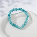 Lake blue marble patterned bead bracelet with crown charm on white heart tray - Blue Marble