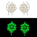 Glow-in-the-dark iridescent floral body jewels emitting green light in darkness - YGXT-05