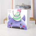 White birthday party gift bag with purple watercolor cartoon monster and rope handle - Little Monster / Small (14*15*7CM)