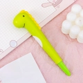 Cute green dinosaur squishy stress relief gel pen on pink decorative background - Dinosaur