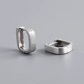 Macro detail of silver square hoop earrings with a modern brushed matte metal texture - Silver