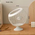 White iron wire coffee pod storage basket with spherical body and pedestal base - Elevated Style: Pure White Basket