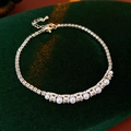 Detail of silver chain bracelet with white pearls and sparkling cubic zirconia stones - Silver