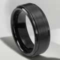 Detail of black brushed stainless steel men's ring with a stepped edge and matte finish - US 6 / Black