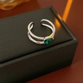 Detail of cross open ring with pear-cut green zircon and shimmering silver setting - Silver-Green