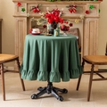 Green round cotton linen Christmas tablecloth with ruffled edges on a festive table - Dark Green Ruffle