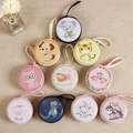 Cartoon tin coin purse for kids featuring colorful animal and fruit patterns - Round Mixed Patterns