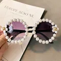 Fashionable round sunglasses featuring a white pearl frame and floral accents for beach vacations - No. 2/Black Frame (Pearl Daisy)