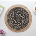 Round jute placemat with black mandala print and fringe tassels in home setting - Type H Jute Tassel