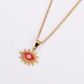 Detail of gold chain necklace featuring red enamel evil eye pendant on neutral background - Gold Red Eyes