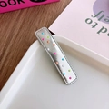 Silver rectangular hair clip with colorful polka dots on a minimalist white tray - Long Bar Silver Colorful Dots