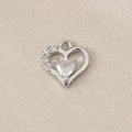 Macro detail of a silver-toned openwork heart pendant with sparkling cubic zirconia inlay - PJ0115-Silver (Heart)