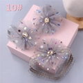 Detailed view of gray mesh flower baby headbands with gold gemstones in a pink gift box - Style 10 (Grey Mesh Flower 3pcs)