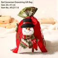 Red drawstring Christmas gift bag featuring a 3D snowman doll and plaid scarf, 26x41 cm - Snowman Gift Bag (Small)