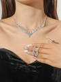 Macro shot of silver-tone bridal necklace and earrings set with flower zircon detail - Full Diamond V-Shape Silver Set(DTN14027185S)