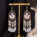 Detail view of Bohemian tassel earrings with beads and water drop pendants on gold stand - S4293-2 White Water Drop Fringe Earrings