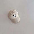 Close-up of beige baseball cap featuring a cute cartoon dog embroidery and DOG text detail - 52-54cm 3-6 Years / Beige