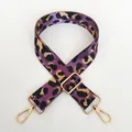 Detail view of purple leopard print nylon wide bag strap with gold metal buckles - Purple + Gold Hook