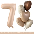 Detail view of 40-inch number 7 foil balloon with matte cream and heart balloons set - Caramel Number 7 / Number And Heart Balloon Combination