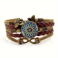 Detail of vintage multilayer leather bracelet with mandala glass gem and bronze butterflies - Brown
