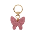 Primer plano del llavero con lazo de strass rosa brillante y anilla de metal dorado - Rosa