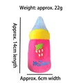 Squeaky plush dog toy in a baby bottle shape with strawberry embroidery, blue 14cm size - Pink Milk Bottle
