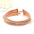 Detail of rose gold triple-layer choker with lobster clasp and fine striped texture - Rose Gold