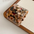 Detail of wide open-cuff acetate resin bangle with vintage tortoiseshell color pattern - Brown