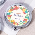 Silver metal folding makeup mirror featuring a colorful floral Happy Mother's Day design - Painted Wreath Mother's Day