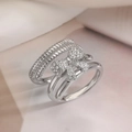 Macro shot of silver-tone double-layered bow ring with sparkling zircon stones - Double Layer Bowknot Ring / Silver