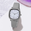 Detailed close-up of a square grey silicone student watch with digital dial display - Gray