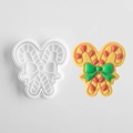 White candy cane cookie mold with bow design and colorful finished frosted cookie - Christmas Candy Cane