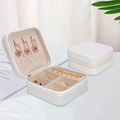 White PU leather travel jewelry box with beige lining and gold zipper closure - Laser White