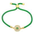 Close-up of green braided bracelet with micro-pave zircon star and golden hardware - Green