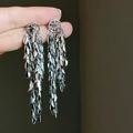 Elegant silver leaf fringe drop earrings with a long cascading metallic tassel design - 11.5CM Silver