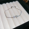 Dettaglio di bracciale regolabile in argento con ciondoli a cuore e stella in zirconi - Cuore Stella (Argento) / Argento