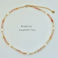 Detail view of pearl and crystal beaded necklace with 11g weight and 40cm length labels - Orange Pink Purple Beaded (1190)