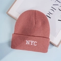 Close-up of NYC embroidery on a ribbed knit beanie showing high-quality stitching texture - One Size / Deep Lotus Pink