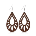 Macro shot of brown hollow-out wooden teardrop earrings with intricate geometric patterns - Style 56