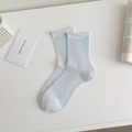 Calze azzurre con lavorazione a costine verticali e bordi arrotolati in stile minimalista - Taglia unica / Azzurro