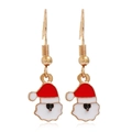 Detailed close-up of Santa Claus hook earrings with red and white enamel on golden metal - Santa Claus #27