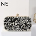 Elegant black evening clutch with floral beadwork and crystal-topped gold frame - Black
