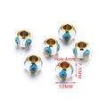 Dettaglio perline in smalto occhio di Allah, diametro 10mm e foro 4mm per gioielli - Base Bianca Occhio Blu