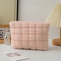Pink quilted puffer makeup bag with soft textured pattern and metal zipper closure - Pink