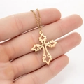Minimalist gold hollow cross pendant necklace elegantly displayed on model neck - Cross Style 1