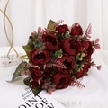 Artificial deep red peony bouquet with green leaves in a stylish home decor setting - Burgundy