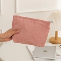 Pink corduroy makeup pouch with zipper closure and soft striped texture - Pink